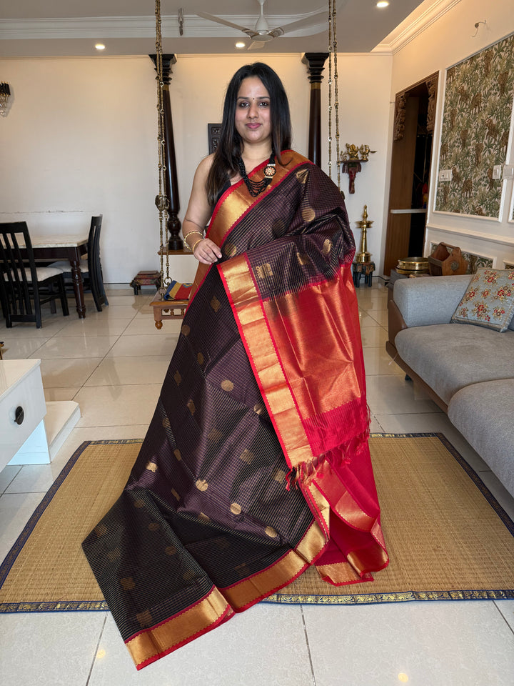 Brown with Red  , zari kattam in the body with Mayil and Chakram butta ,traditional borders and rich Pallu Silk Cotton Saree