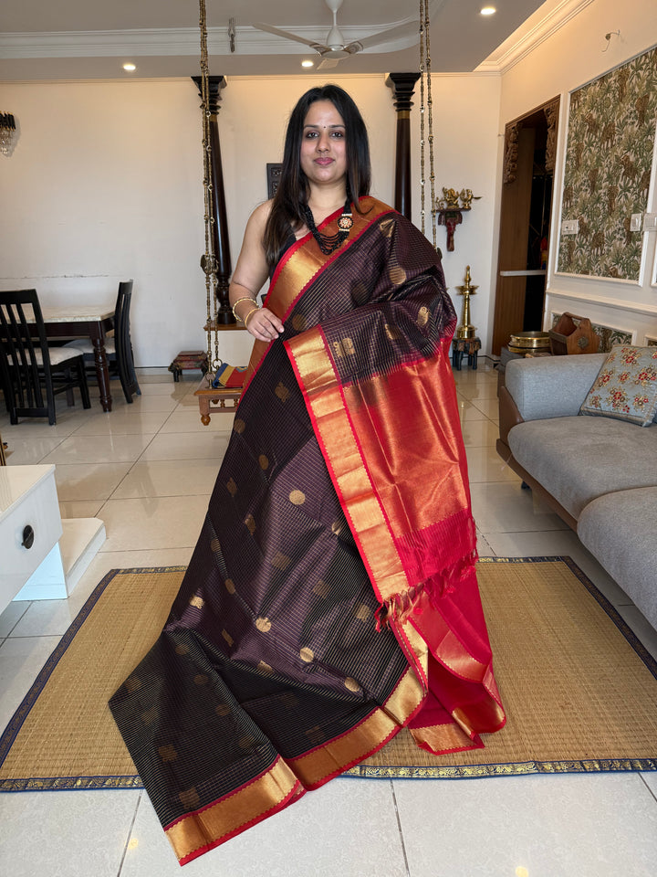 Brown with Red  , zari kattam in the body with Mayil and Chakram butta ,traditional borders and rich Pallu Silk Cotton Saree