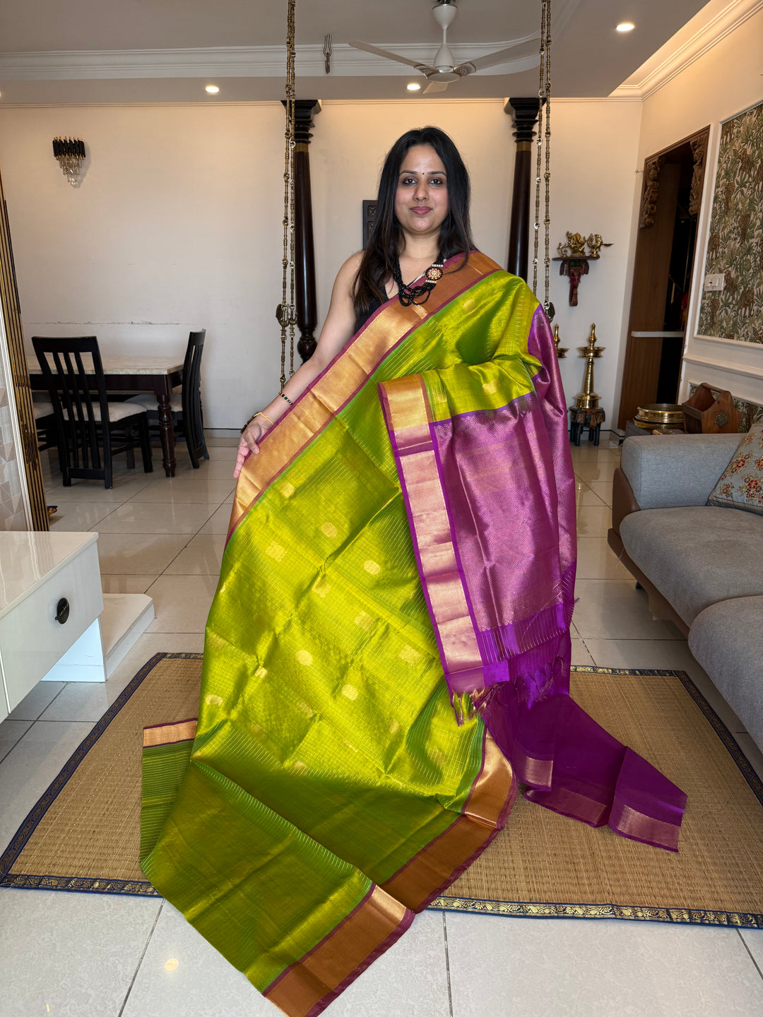 Parrot Green with Purple ,zari kattam in the body with Mayil and Chakram butta ,traditional borders and rich Pallu Silk Cotton Saree