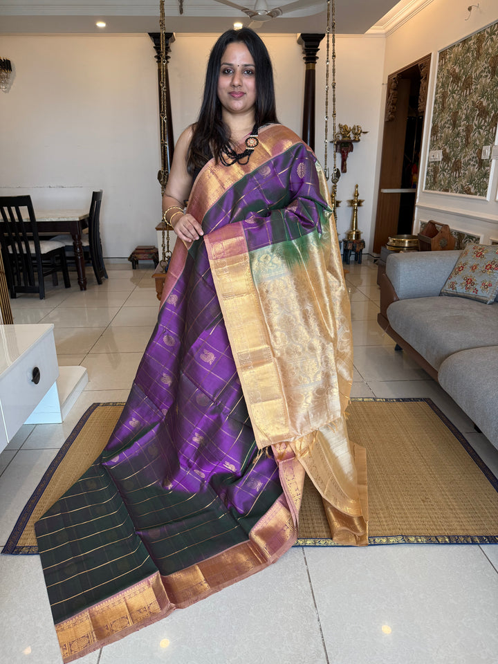 Double shaded Purple with Biscuit colour  , zari kattam in the body with Mayil and Chakram butta ,traditional borders and rich Pallu Silk Cotton Saree