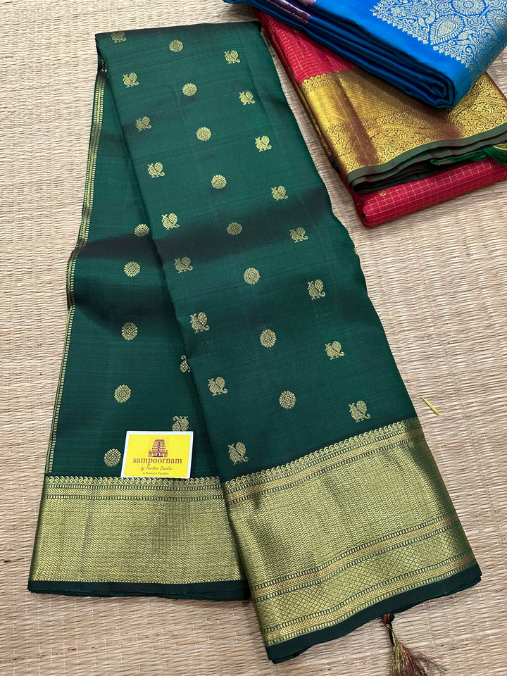 Dark Green with Zari Butta all over the Body Rich Border And Pallu Pure Kanjivaram Silk Saree