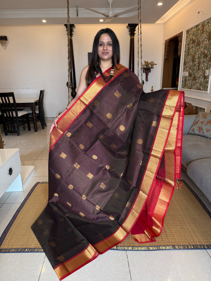 Brown with Red  , zari kattam in the body with Mayil and Chakram butta ,traditional borders and rich Pallu Silk Cotton Saree