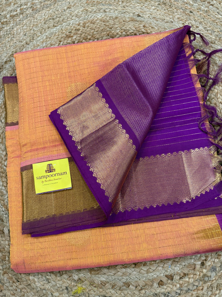 Peachish Orange with Purple colour , zari kattam in the body with Mayil and Chakram butta ,traditional borders and rich Pallu Silk Cotton Saree