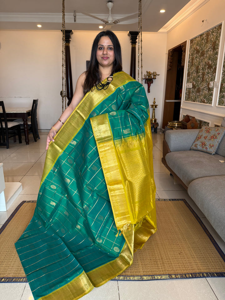 Rexona Green with Lemon Yellow colour , zari kattam in the body with Mayil and Chakram butta ,traditional borders and rich Pallu Silk Cotton Saree