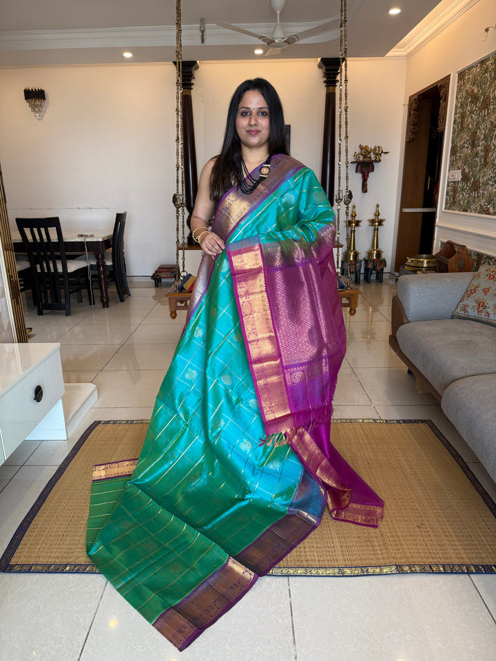Ramar Blue with Purple  , zari kattam in the body with Mayil and Chakram butta ,traditional borders and rich Pallu Silk Cotton Saree