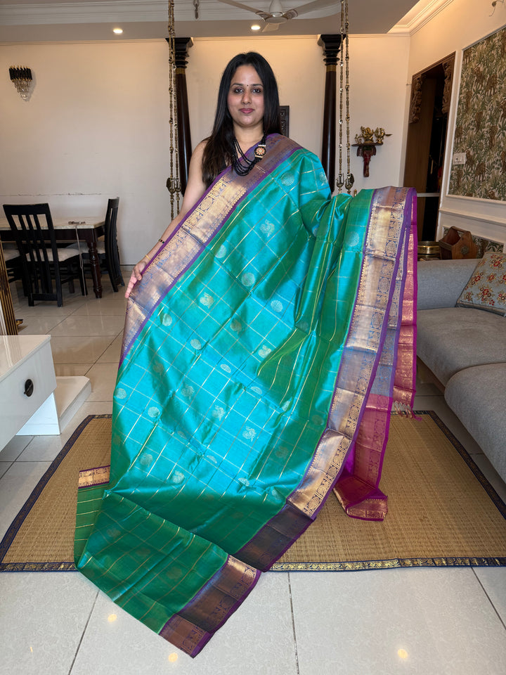 Ramar Blue with Purple  , zari kattam in the body with Mayil and Chakram butta ,traditional borders and rich Pallu Silk Cotton Saree