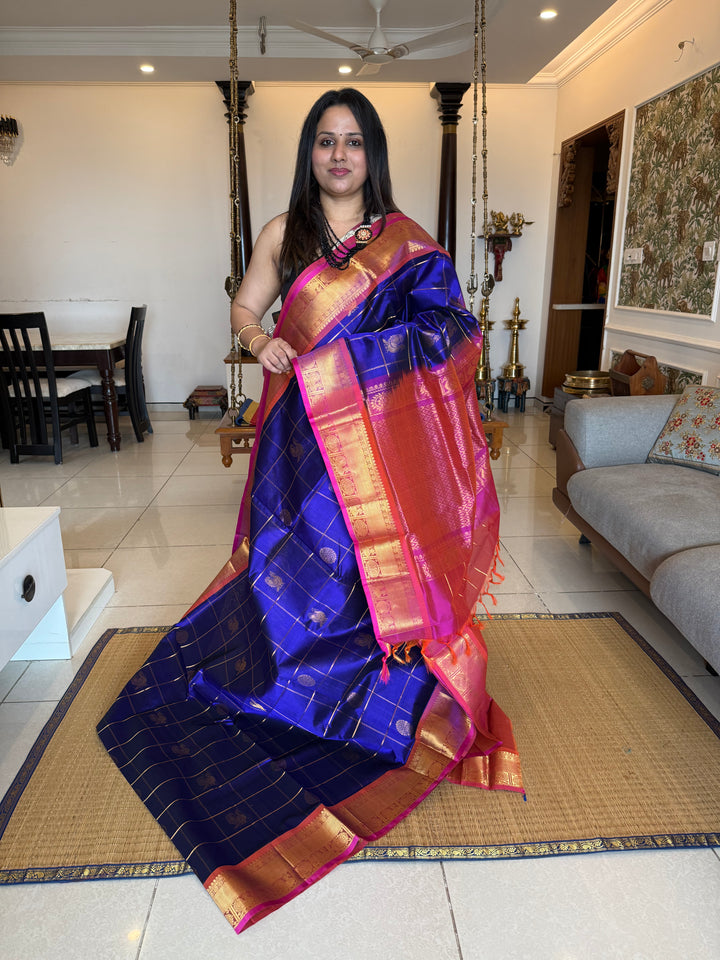 Blue with Dark Pink  , zari kattam in the body with Mayil and Chakram butta ,traditional borders and rich Pallu Silk Cotton Saree