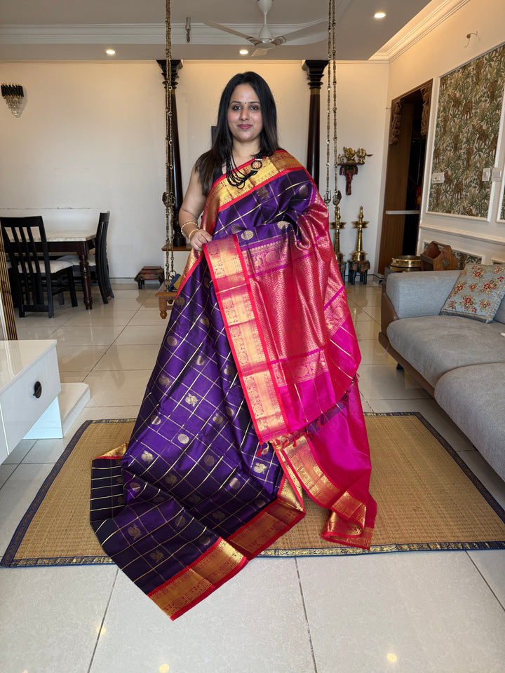 Purple with Pink , Red Selvedge  , zari kattam in the body with Mayil and Chakram butta ,traditional borders and rich Pallu Silk Cotton Saree