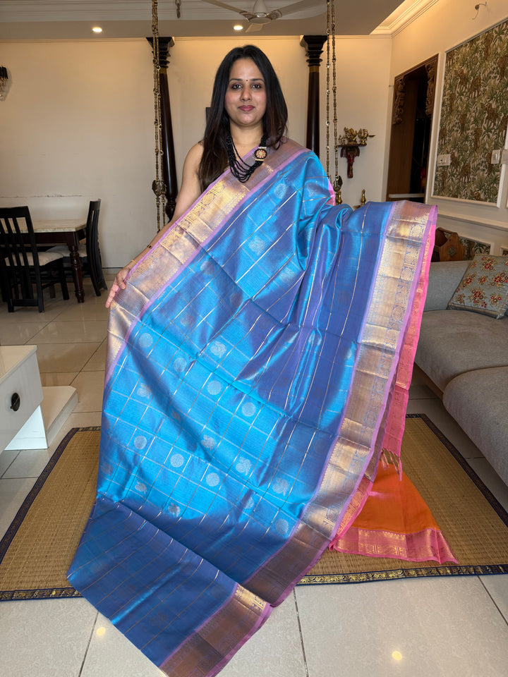 Pastel Blue with Baby Pink colour , zari kattam in the body with Mayil and Chakram butta ,traditional borders and rich Pallu Silk Cotton Saree