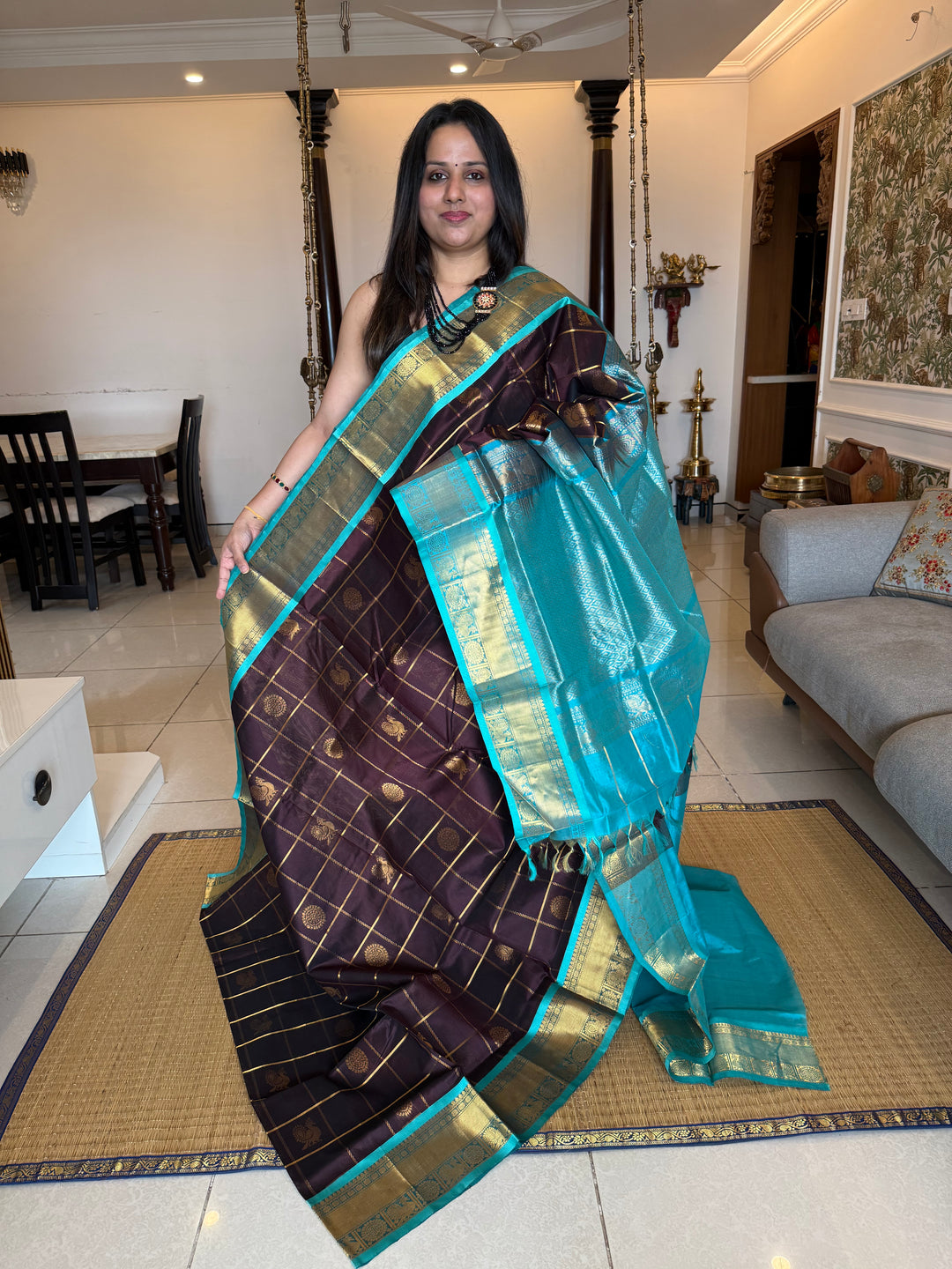 Brown with Turquoise Blue  , zari kattam in the body with Mayil and Chakram butta ,traditional borders and rich Pallu Silk Cotton Saree