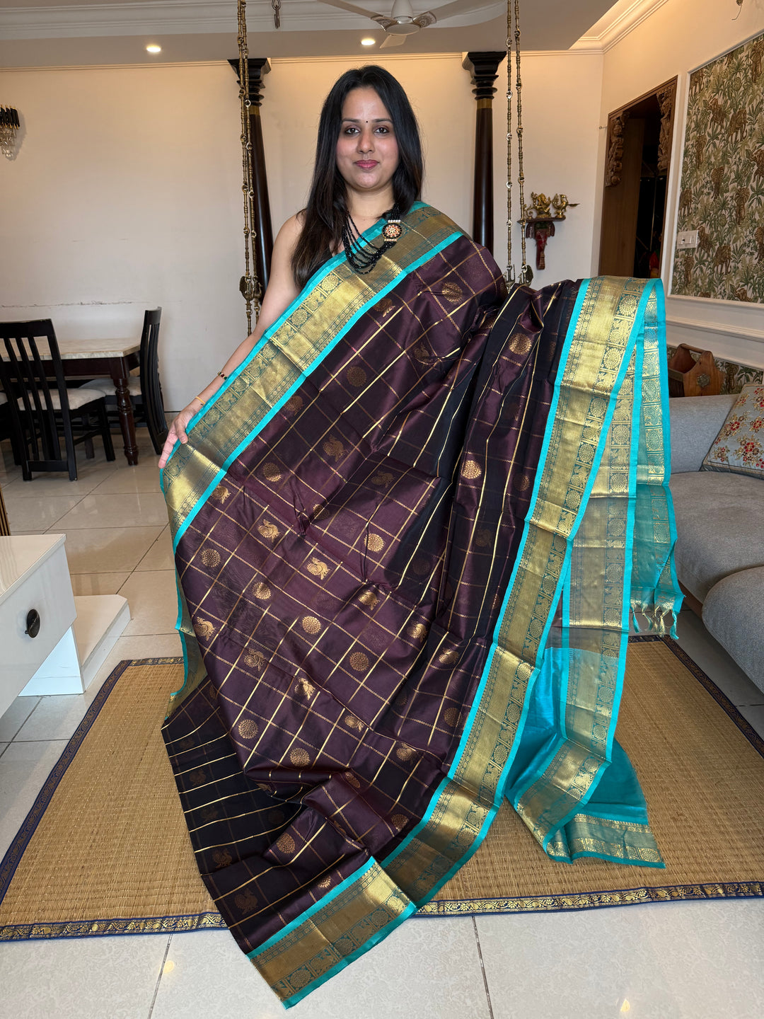 Brown with Turquoise Blue  , zari kattam in the body with Mayil and Chakram butta ,traditional borders and rich Pallu Silk Cotton Saree