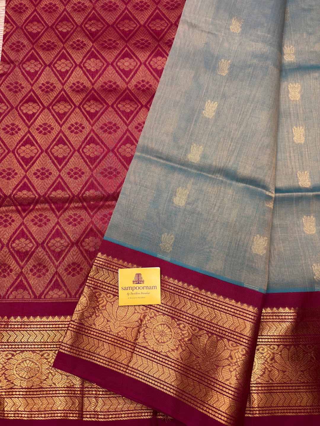 Sage Green with Maroon , Rich Lotus Butta in the body , Traditional borders and rich Pallu Korvai Silk Cotton Saree