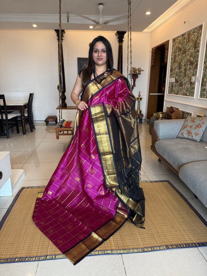 Magenta with Black  , zari kattam in the body with Mayil and Chakram butta ,traditional borders and rich Pallu Silk Cotton Saree