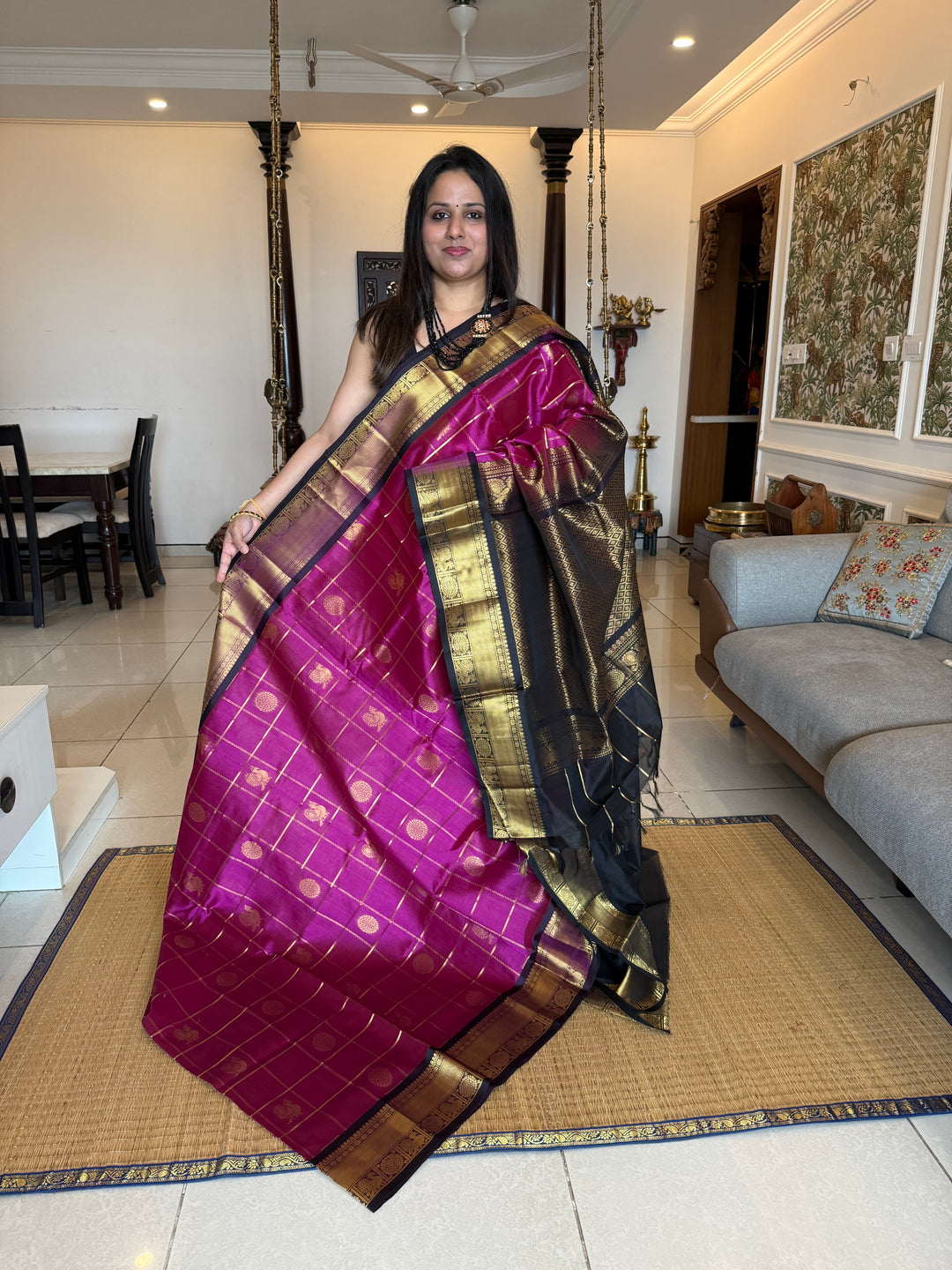 Magenta with Black  , zari kattam in the body with Mayil and Chakram butta ,traditional borders and rich Pallu Silk Cotton Saree