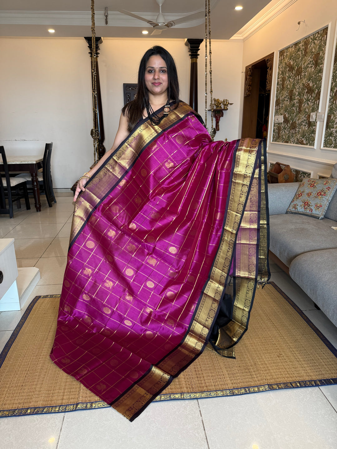Magenta with Black  , zari kattam in the body with Mayil and Chakram butta ,traditional borders and rich Pallu Silk Cotton Saree