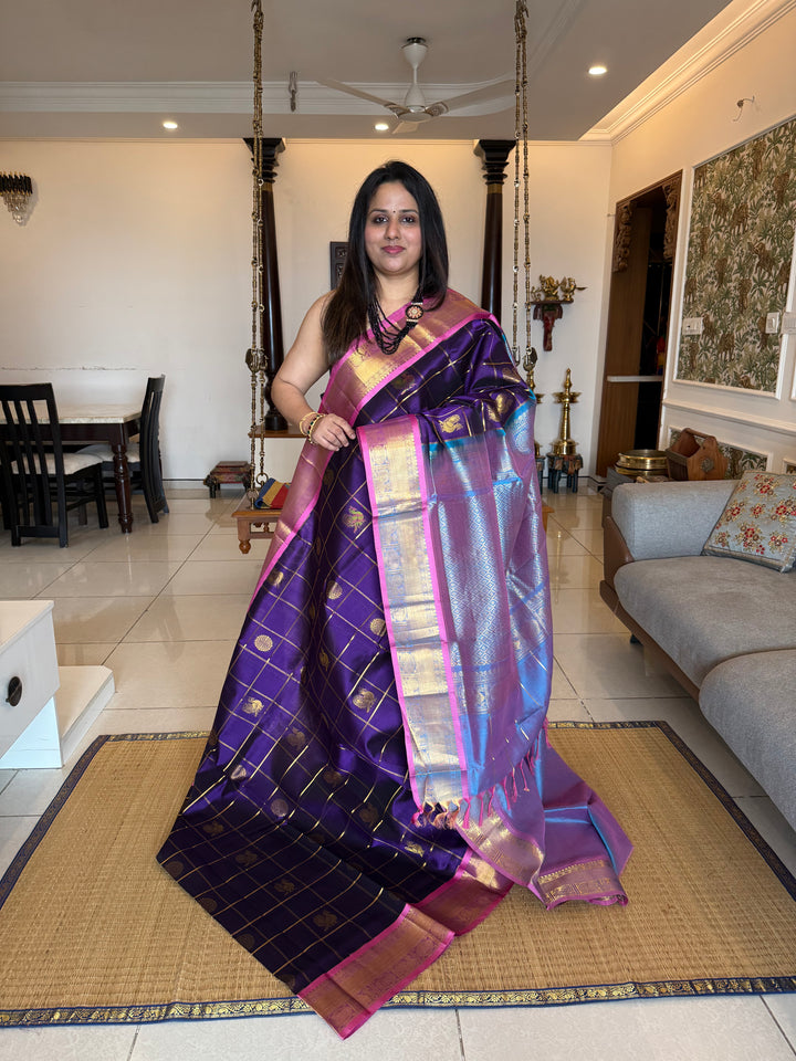 Purple with Blueish Pink colour ,Baby Pink selvedge ,zari kattam in the body with Mayil and Chakram butta ,traditional borders and rich Pallu Silk Cotton Saree