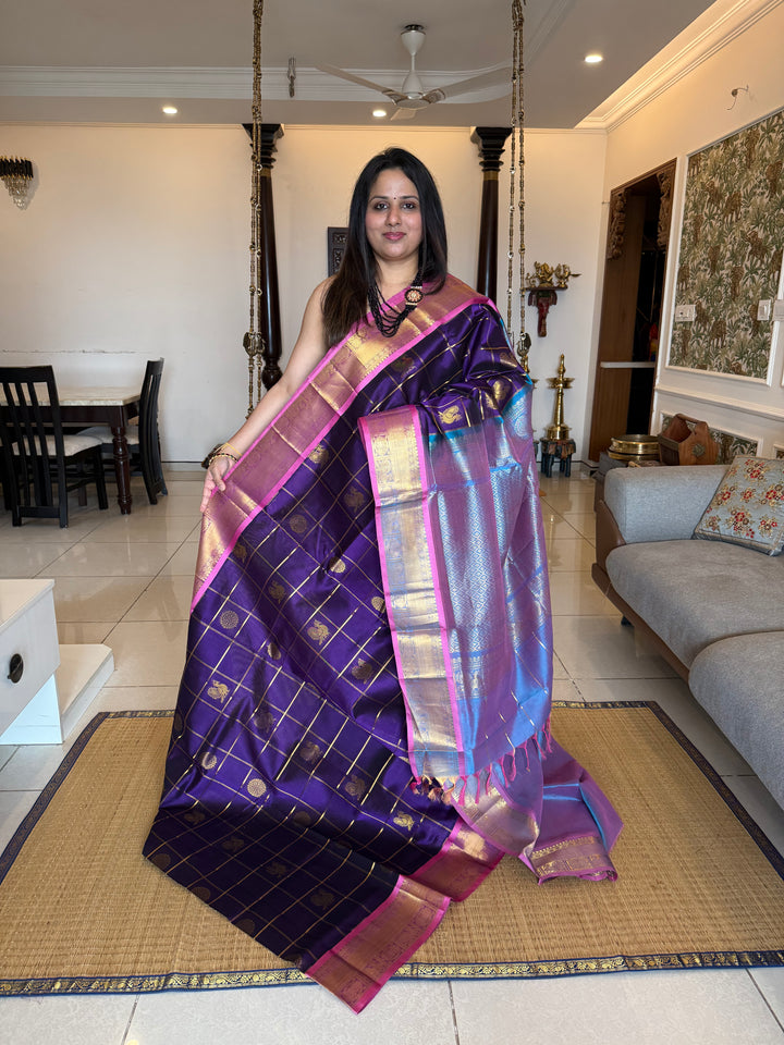 Purple with Blueish Pink colour ,Baby Pink selvedge ,zari kattam in the body with Mayil and Chakram butta ,traditional borders and rich Pallu Silk Cotton Saree