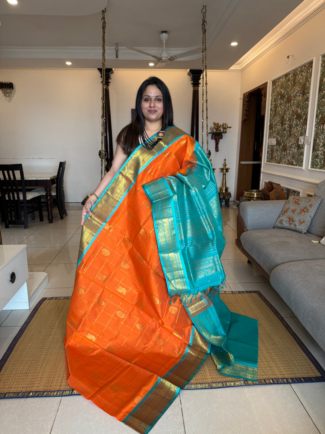 Orange with Turquoise Blue colour , zari kattam in the body with Mayil and Chakram butta ,traditional borders and rich Pallu Silk Cotton Saree