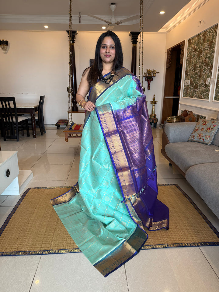 Light Blue with Dark Blue  , zari kattam in the body with Mayil and Chakram butta ,traditional borders and rich Pallu Silk Cotton Saree