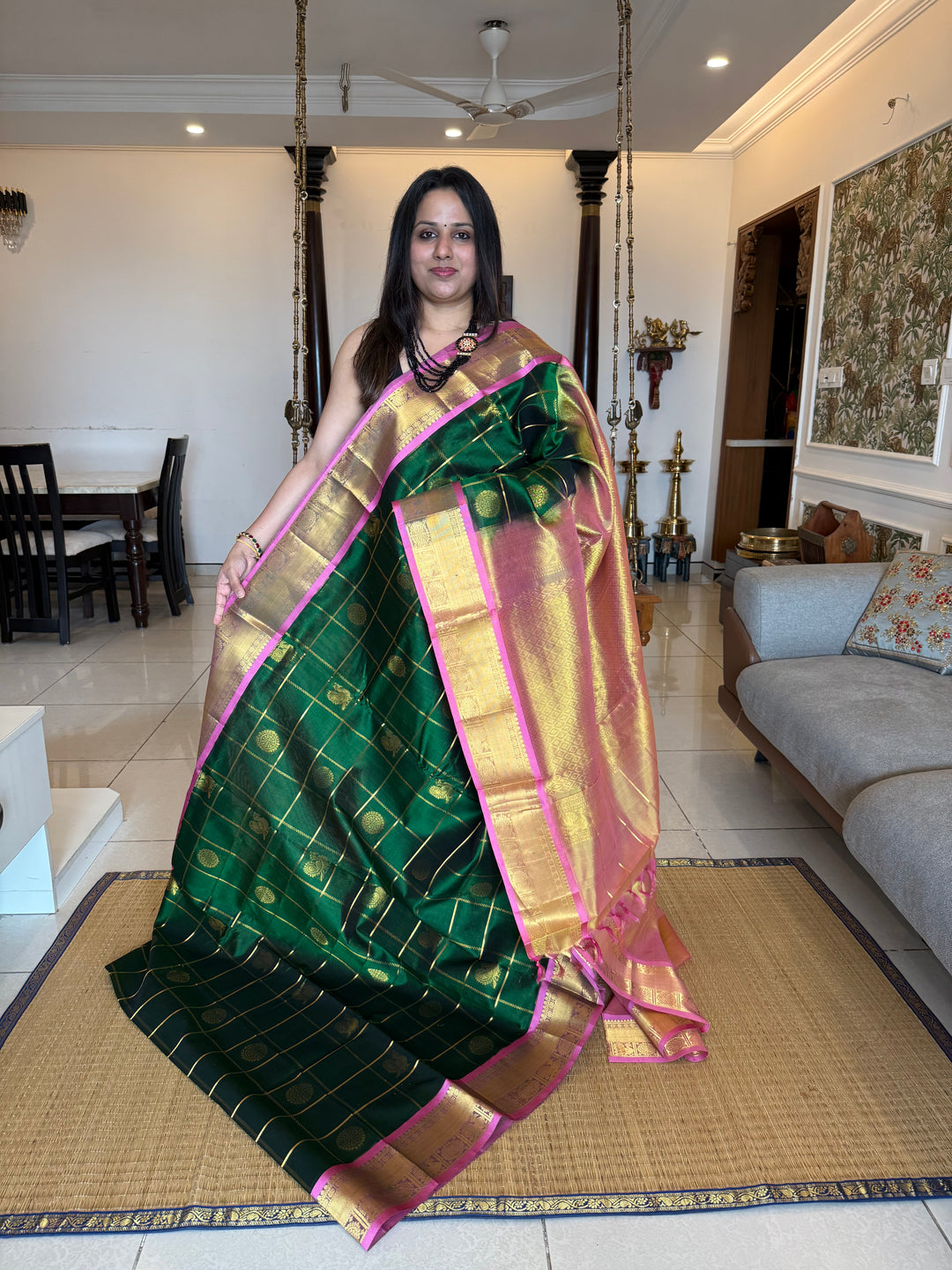 Green with Peachish Pink , Baby Pink Selvedge  , zari kattam in the body with Mayil and Chakram butta ,traditional borders and rich Pallu Silk Cotton Saree