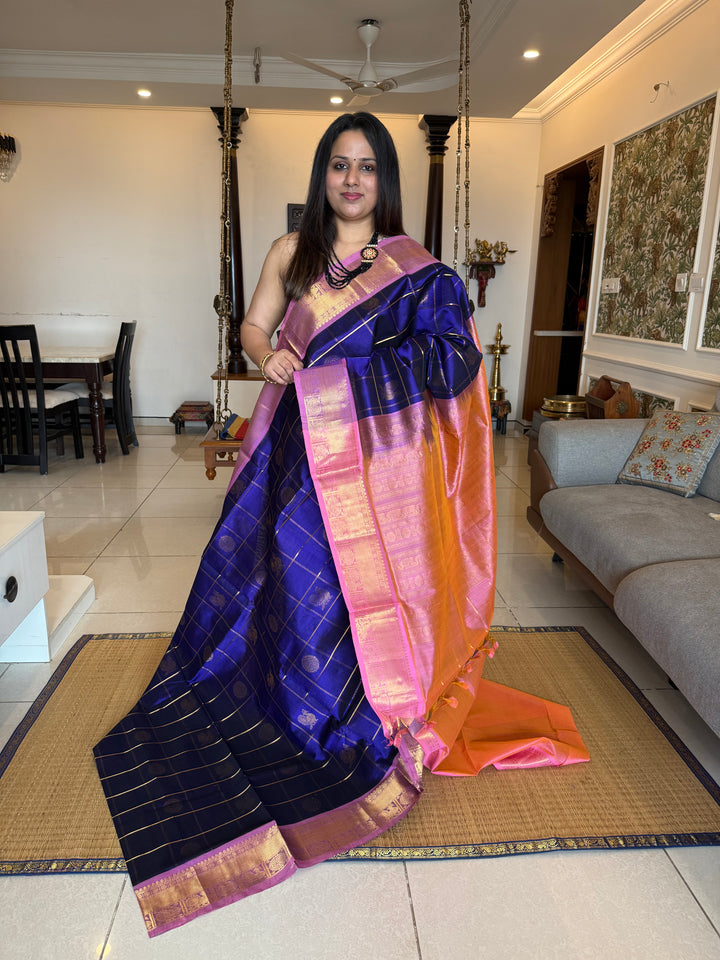 Blue with Baby Pink  , zari kattam in the body with Mayil and Chakram butta ,traditional borders and rich Pallu Silk Cotton Saree