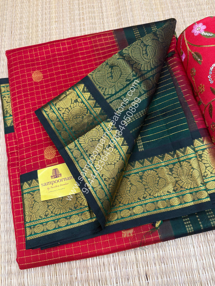 Red with Green , Rich Zari checks in the body , Mayil and Chakram rich butta in the body , Rettapet border and Grand Pallu Korvai Silk Cotton Saree