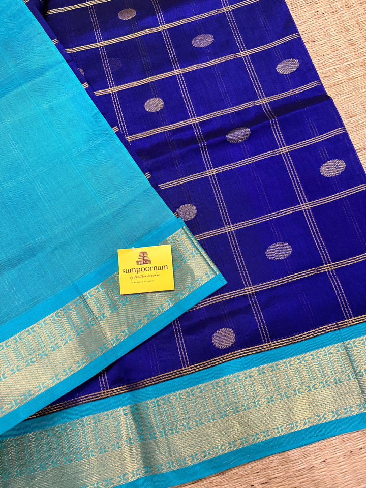 Dark Blue with Light Blue , rich Zari checks in the body with zari butta , ,traditional borders and rich Pallu korvai Silk Cotton Saree
