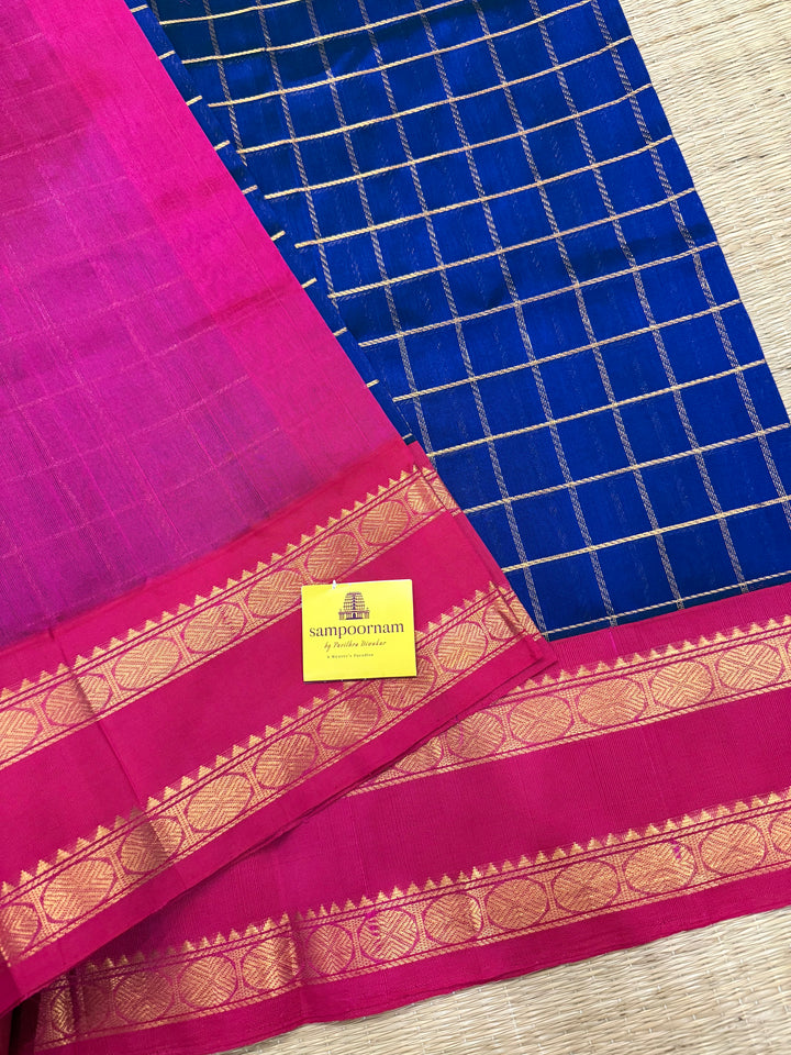 Blue with Pink , zari checks in the body , rettepet border and rich Pallu Korvai Silk Cotton Saree