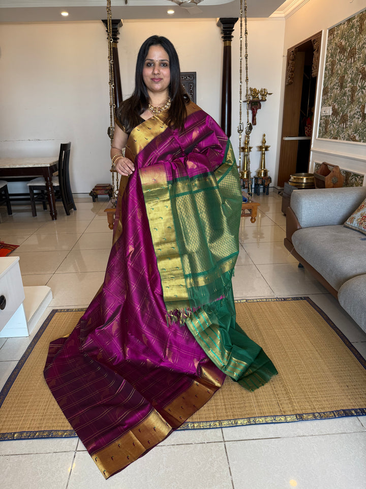 Purple with Dark Green , zari body checks with Parrot Motifs in the body , traditional Paithani borders and rich Pallu Silk Cotton Saree
