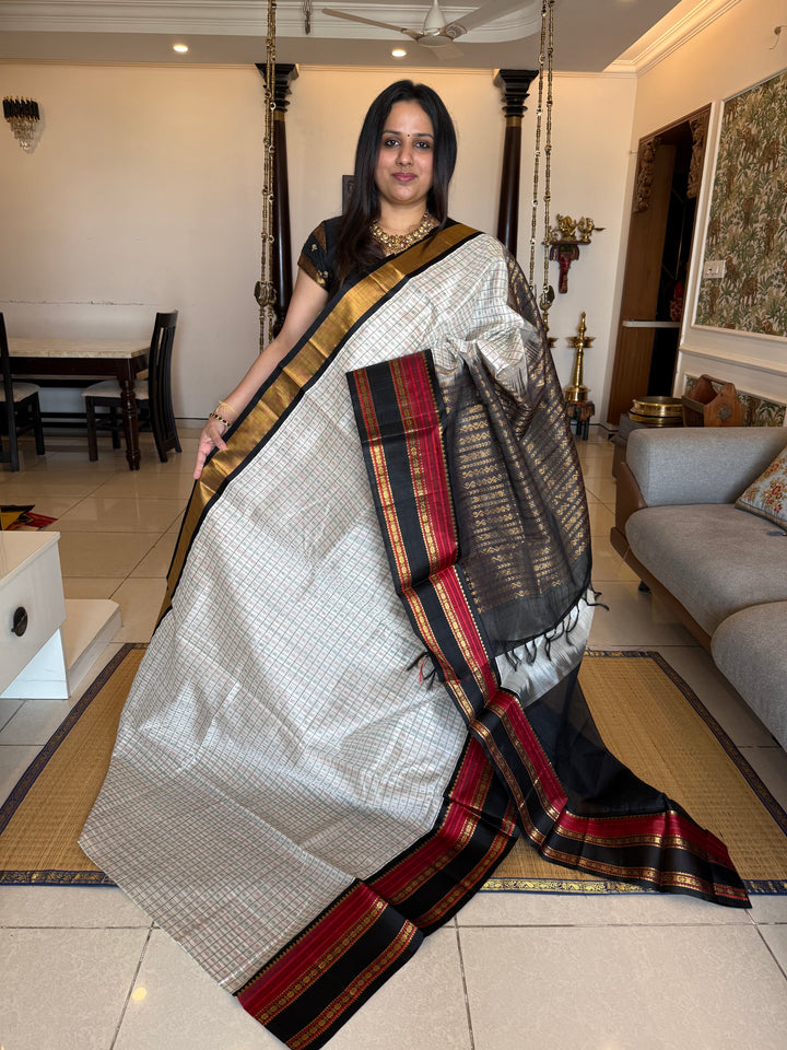 White with Black Lakshadeepam thread pattern in the body with traditional borders and rich Pallu Korvai Silk Cotton Saree