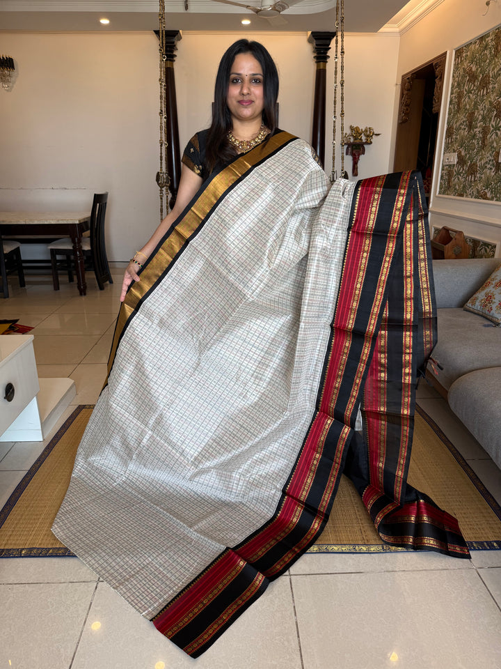 White with Black Lakshadeepam thread pattern in the body with traditional borders and rich Pallu Korvai Silk Cotton Saree
