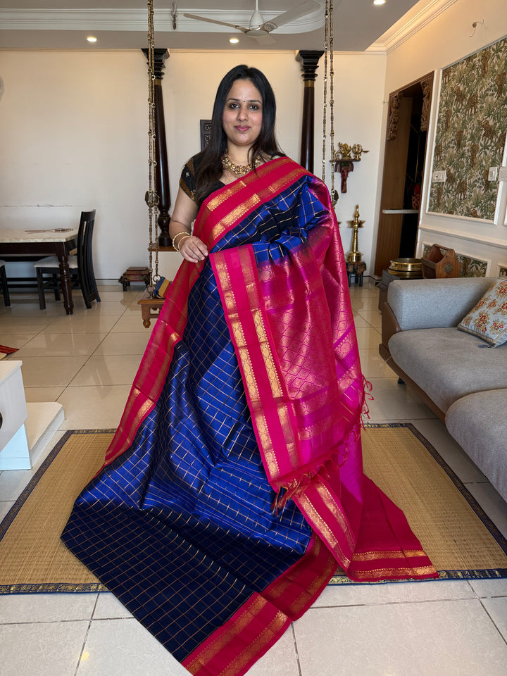 Blue with Pink , zari checks in the body , rettepet border and rich Pallu Korvai Silk Cotton Saree