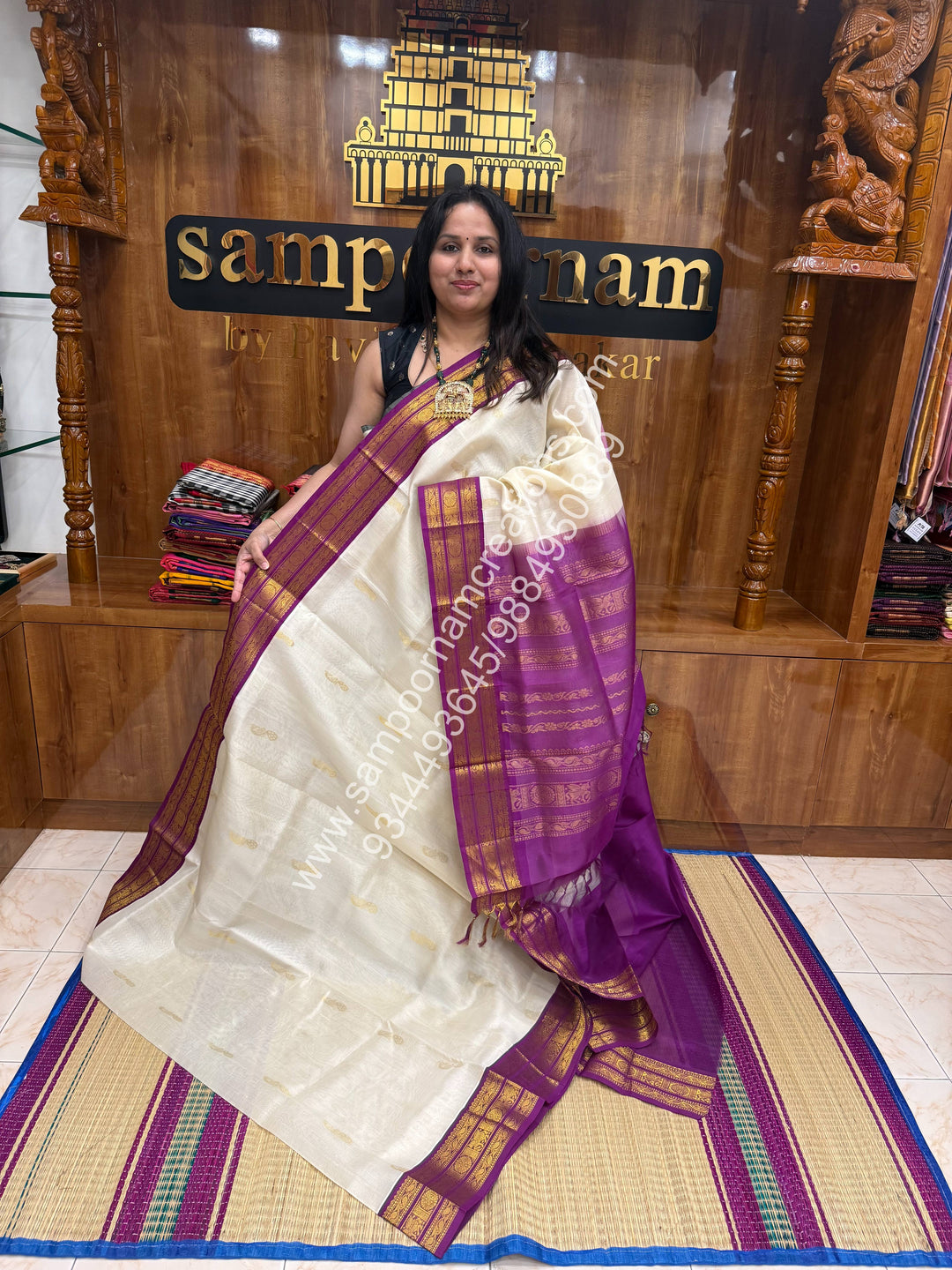 Offwhite with Dark Magenta , Mayil Zari butta in the body , traditional border and Grand Pallu Korvai Silk Cotton Saree