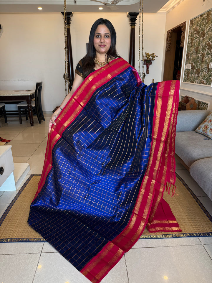 Blue with Pink , zari checks in the body , rettepet border and rich Pallu Korvai Silk Cotton Saree