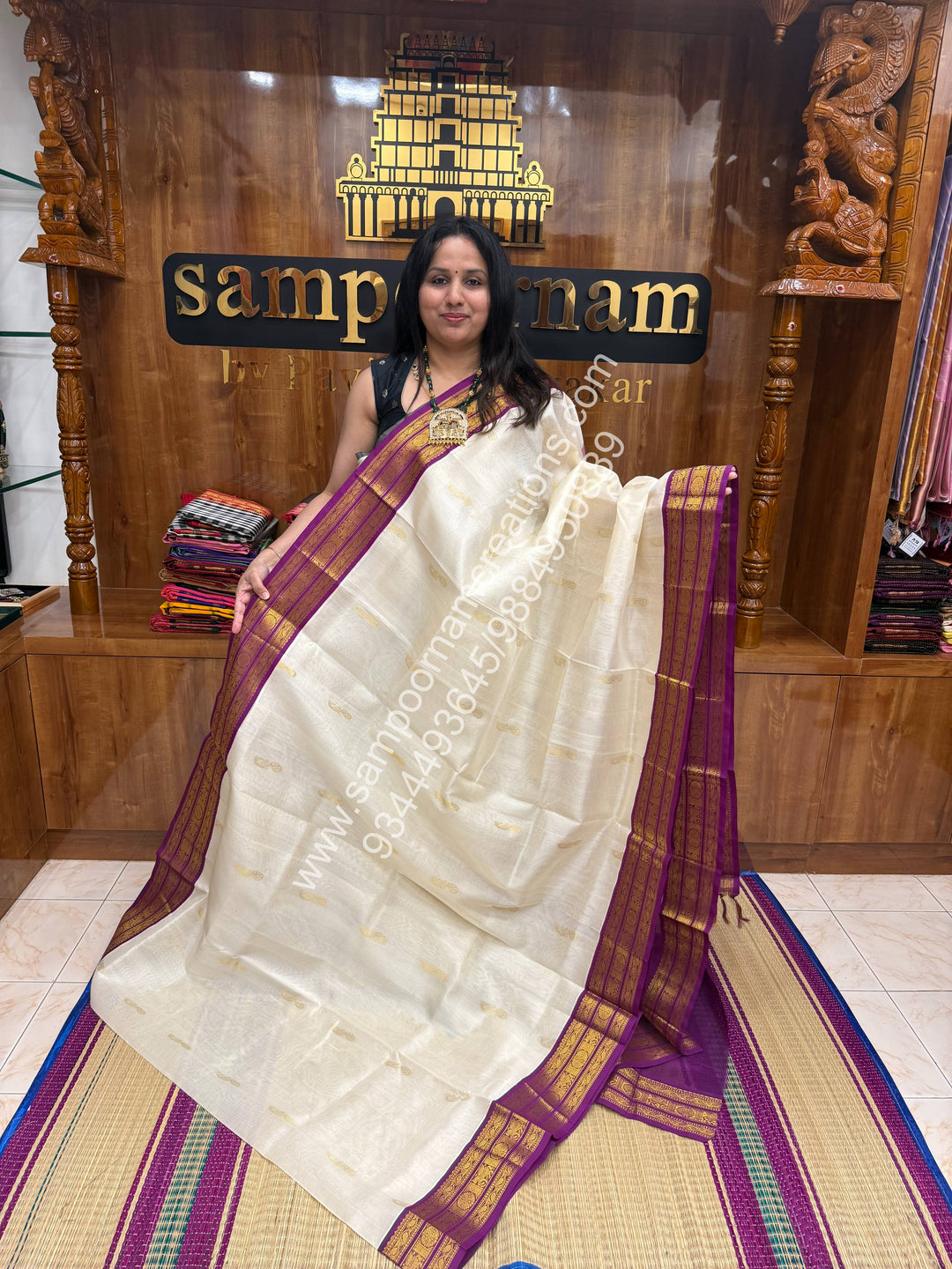 Offwhite with Dark Magenta , Mayil Zari butta in the body , traditional border and Grand Pallu Korvai Silk Cotton Saree