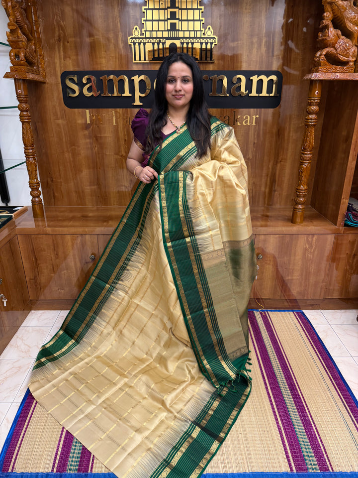 Ivory with Dark Green  , Rich Zari Checks in the body and Grand Pallu Pure Soft Silk Saree