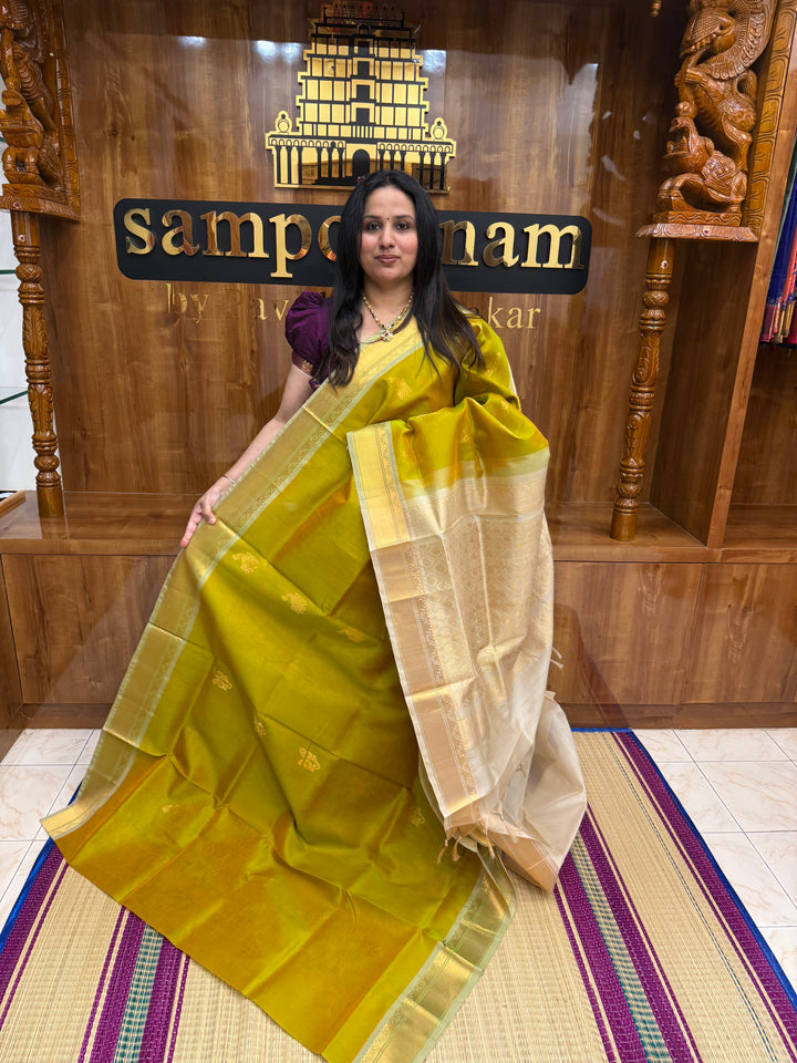 Double Shaded  Manthulir Green with Cream  ,  Rich Mayil and Mango Zari butta in the body , Traditional  Borders and Rich Pallu Silk Cotton Saree