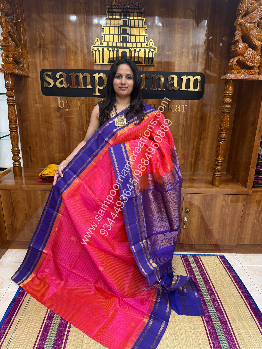 Peachish Pink with Blue , Rich Zari checks in the body , Mayil and Chakram rich butta in the body , Rettapet border and Grand Pallu Korvai Silk Cotton Saree