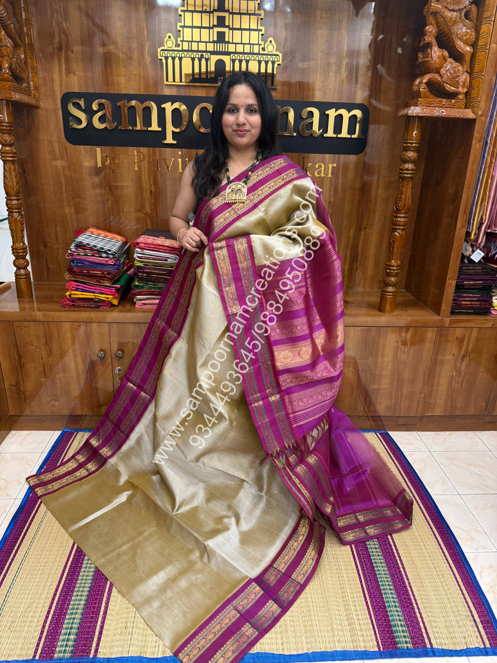 Dark Beige with Dark Magenta , rich Zari butta in the body , Rettapet border and Grand Pallu Korvai Silk Cotton Saree