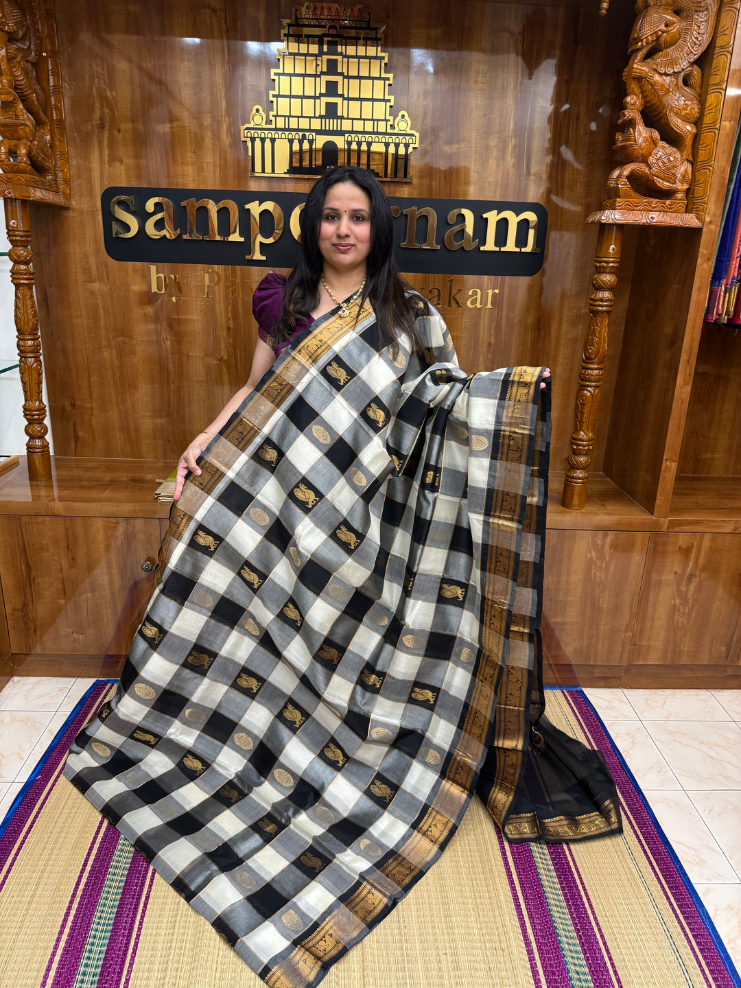 Black with White , Rich Zari checks with Mayil and Chakram Zari Motif in the body , Traditional  Borders and Rich Pallu Silk Cotton Saree