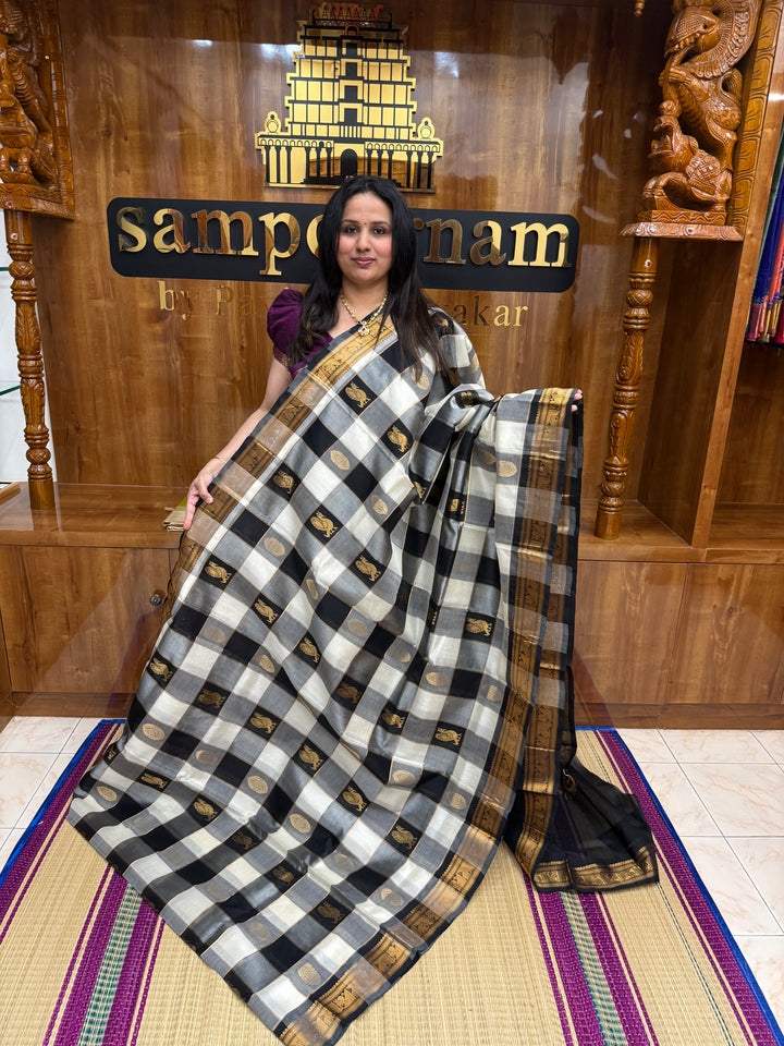 Black with White , Rich Zari checks with Mayil and Chakram Zari Motif in the body , Traditional  Borders and Rich Pallu Silk Cotton Saree
