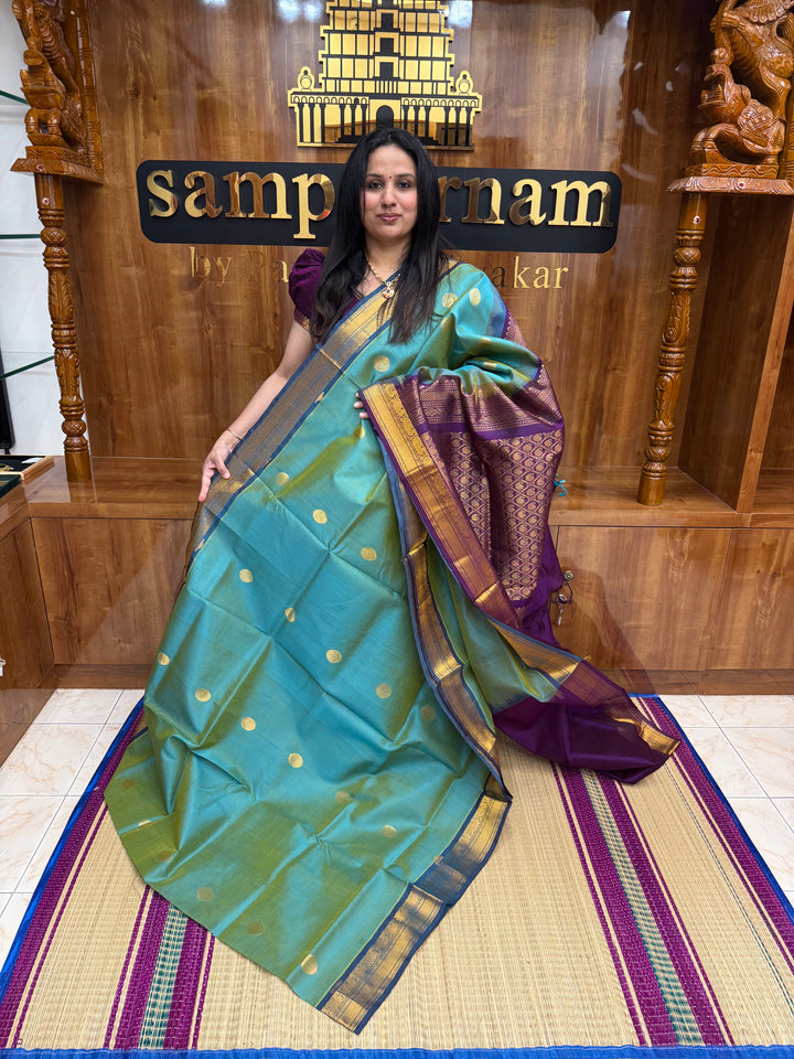 Double Shaded Teal with Purple  ,  Rich Coin Zari butta in the body , Tradition Borders and Rich Pallu Silk Cotton Saree