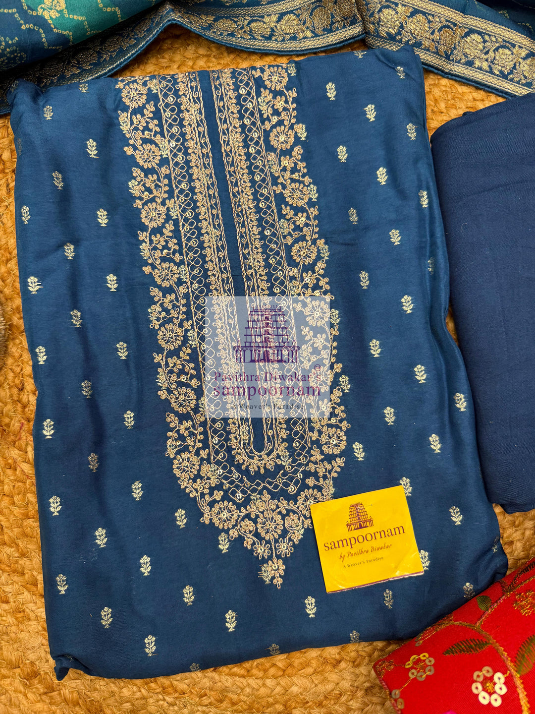 Blue Semi Banarasi Silk printed top with rich Embroidery in the Yoke and a Heavy Designer Dupatta with Tassels and Plain Bottom
