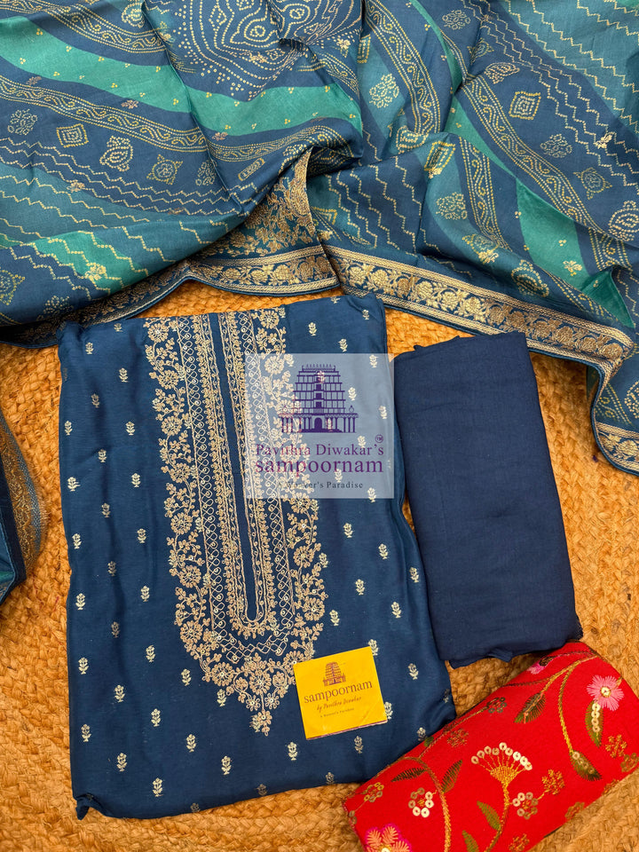 Blue Semi Banarasi Silk printed top with rich Embroidery in the Yoke and a Heavy Designer Dupatta with Tassels and Plain Bottom