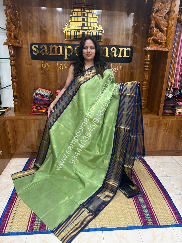 Pastel Green with Dark Blue  , Annam and Chakram Zari butta in the body , Rich Kanchi border , Grand Pallu Korvai Silk Cotton Saree