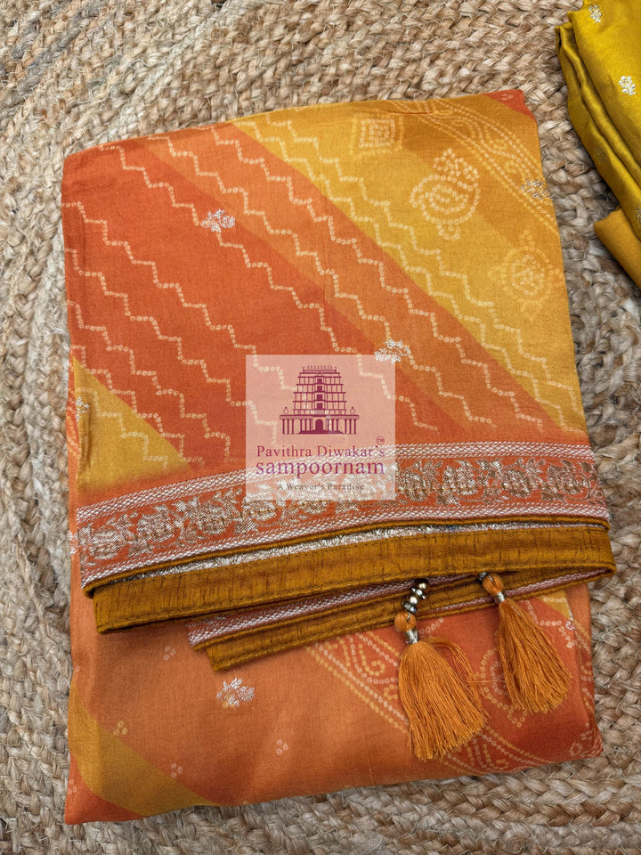 Mustard Semi Banarasi Silk printed top with rich Embroidery in the Yoke and a Heavy Designer Dupatta with Tassels and Plain Bottom