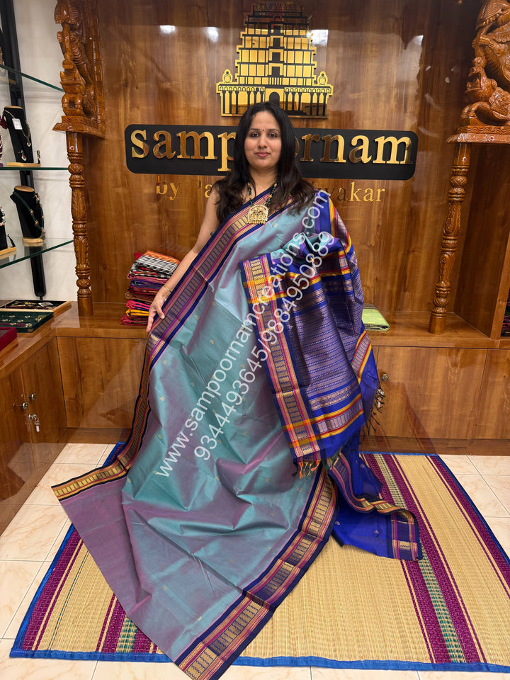 Pinkish  Grey with Blue , Rich Mango Zari butta in the body , Traditional borders and Grand Pallu Korvai Silk Cotton Saree
