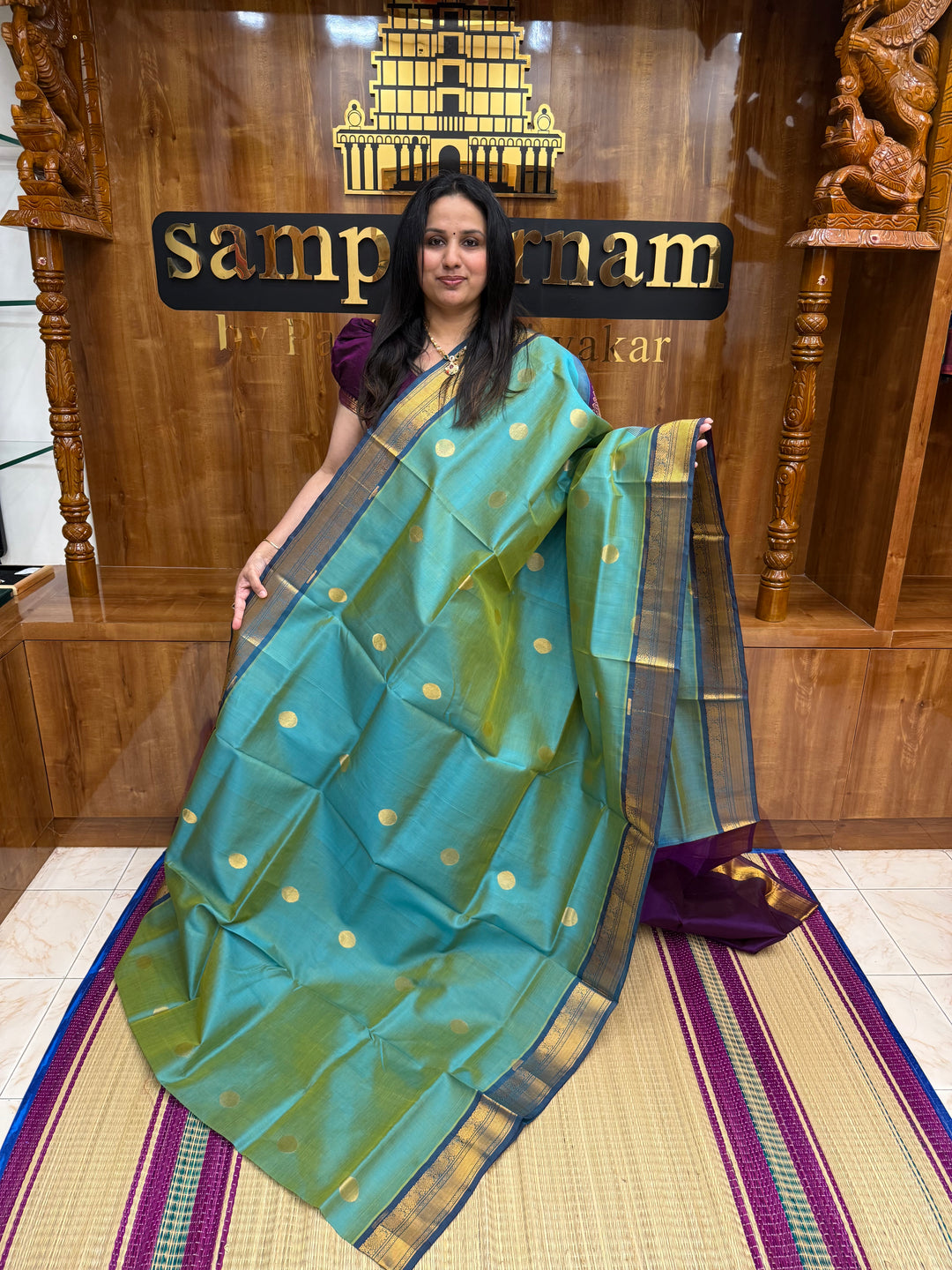 Double Shaded Teal with Purple  ,  Rich Coin Zari butta in the body , Tradition Borders and Rich Pallu Silk Cotton Saree