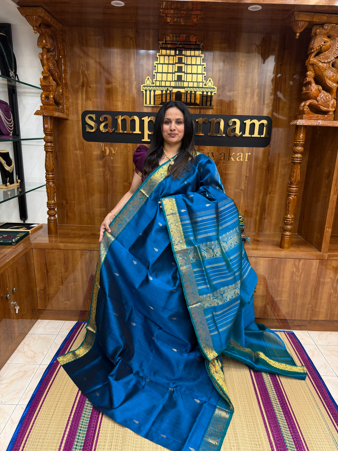 Mayil Blue ,  Rich Tilakam Zari butta in the body , Traditional Borders and Rich Pallu Silk Cotton Saree