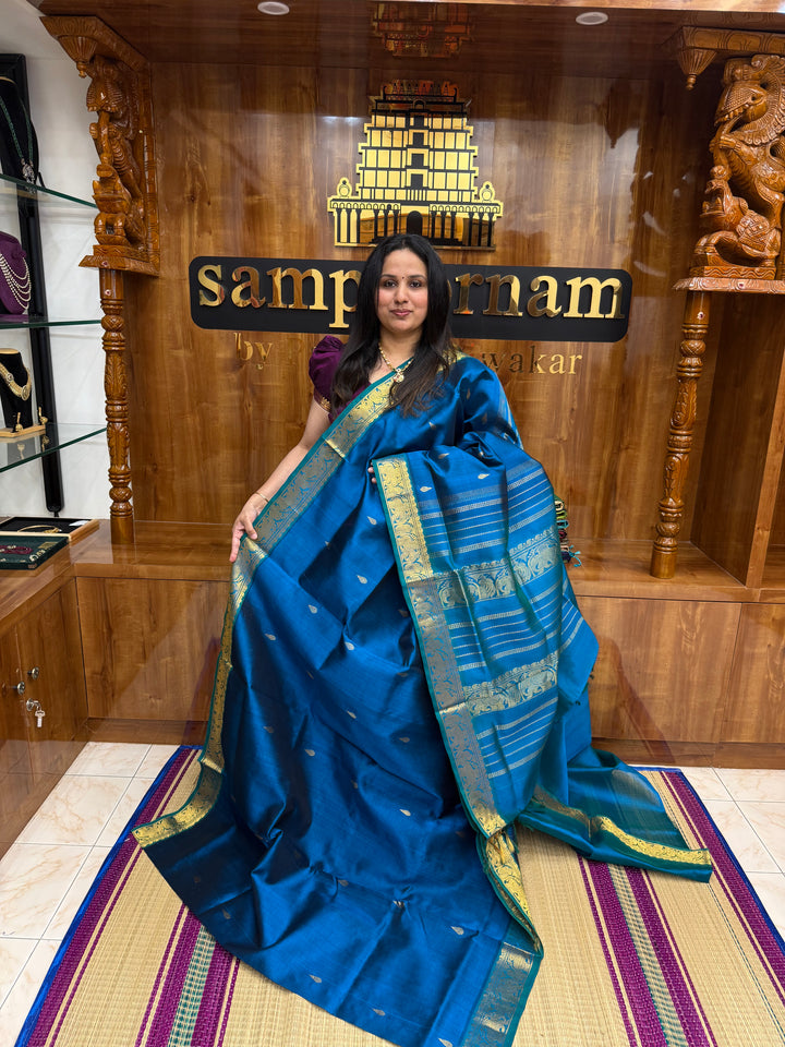 Mayil Blue ,  Rich Tilakam Zari butta in the body , Traditional Borders and Rich Pallu Silk Cotton Saree